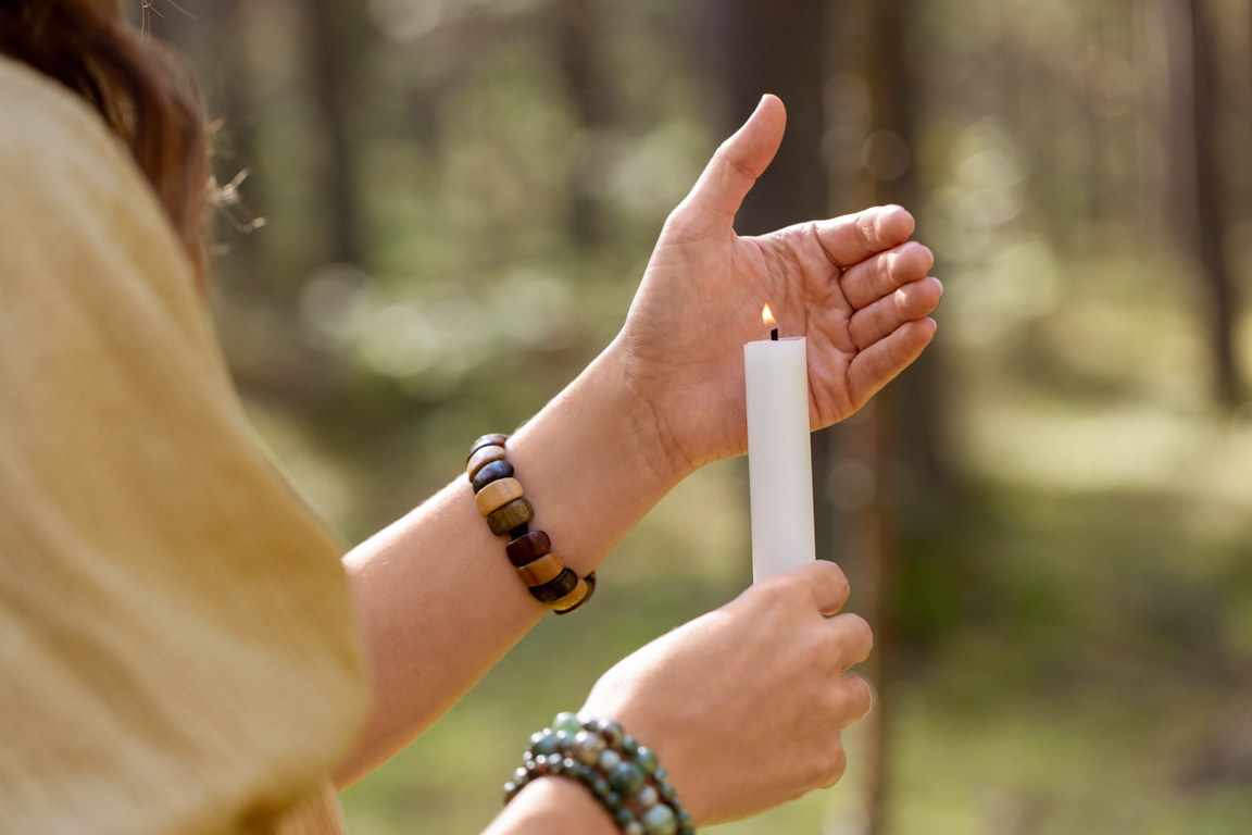 Woman with Candle Performing Magic Ritual